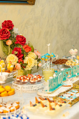 table setting with flowers and sweets