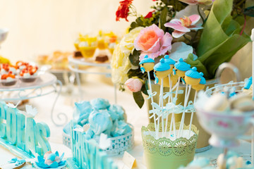 table setting with flowers and sweets