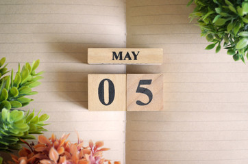 May 5, Appointment date with number cube design for background.