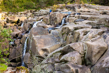 Water flowing over large boulders