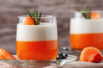 Panna Cotta with tangerines, jelly and rosemary, Italian dessert, home cooking. Copy space