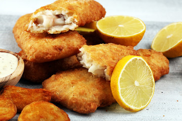 traditional British fish and chips consisting of fried fish, potato chips and mayonnaise