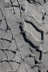 Tire imprints on the sand in blak and white