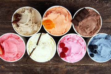 Various of ice cream flavor with fresh blueberry, strawberry, almond, chocolate, vanilla setup on rustic background . Summer and Sweet cold ice cream
