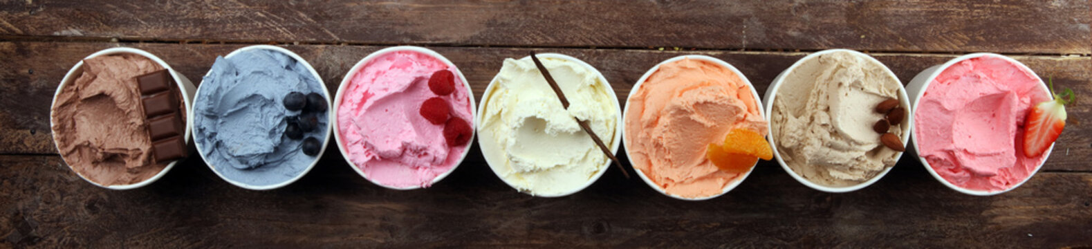 Various of ice cream flavor with fresh blueberry, strawberry, almond, chocolate, vanilla setup on rustic background . Summer and Sweet cold ice cream