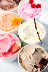 Various of ice cream flavor with fresh blueberry, strawberry, almond, chocolate, vanilla setup on rustic background . Summer and Sweet cold ice cream