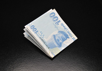 Turkish banknotes on black background