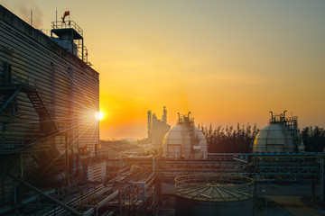 Gas storage sphere tanks and pipeline in petrochemical industrial plant on sky sunset background, Manufacturing of petroleum industry plant