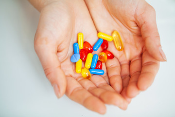 Close up of female doctor holding pill