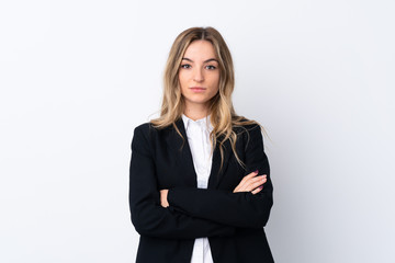 Obraz premium Young business woman over isolated white background keeping arms crossed