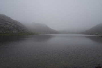 Foggy lake beyond the arctic circle in Summer