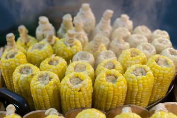 Vegan food ,Steamed sweet corn in market.