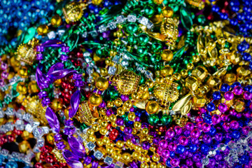Fototapeta na wymiar Top down view of colorful festival beads with a shallow depth of field.