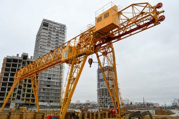 High heavy yellow metal iron load-bearing construction stationary industrial powerful gantry crane...