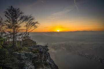Fototapeta na wymiar Sunrise on mount Papststein - Sonnenaufgang auf dem Papststein