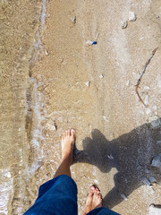 Man walking along a lake