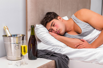 Man in the bed after party - Hangover concept