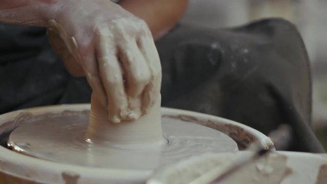 Close-up, Slow Motion, Hands of The Potter Woman Work with Clay on the Potter's Circle