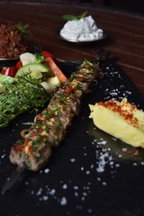 grilled steak with vegetables on the table