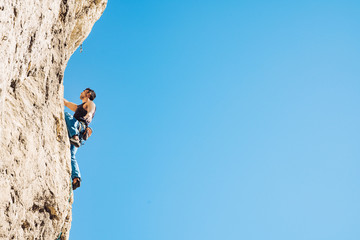 Man climbs a rock.