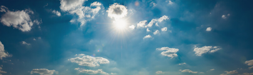 Naklejka na ściany i meble panorama blue sky with sun and white cloud