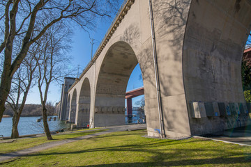 Sunny winter view by the &Aring;rsta train bridges and the bay between the Stockholm districts Marievikshamn, &Aring;rstadal, Tantolunden, Hornstull, Liljeholmen
