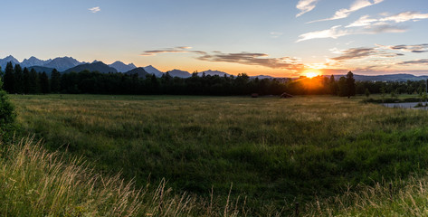 Panorama Sunset in the bavarian alps with blue sky