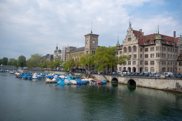 The limmat river with beautiful medieval europe buildings on blue sky with cloud background , copy space , Zurich , Switzerland