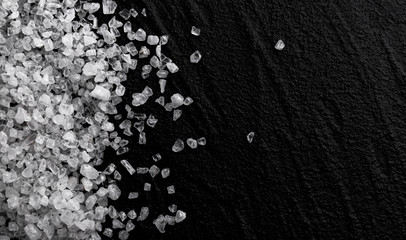 Pile of sea salt on black background