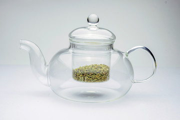 fennel seeds loose inside glass teapot ready to be brewed for healthy drink on white background