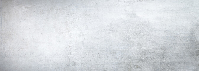 Texture of a smooth white concrete wall with cracks as a background or wallpaper