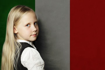 Thinking child girl student against the Italy flag background. Italian concept