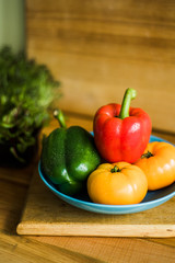 Colorful of Fresh Sweet Peppers on a Wooden Dish, Raw Organic Vegetable on a Table Ready to Cooking in The Kitchen Room.