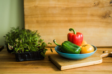 Colorful of Fresh Sweet Peppers on a Wooden Dish, Raw Organic Vegetable on a Table Ready to Cooking in The Kitchen Room.