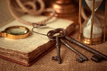 Old vintage items of the treasure hunter, traveler and discoverer - a magnifying glass, old...