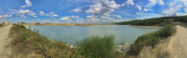 Fototapeta na wymiar landscape with lake and blue sky