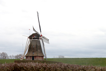 .The Molen van Waardenburg is a hexagonal thatched ground sailor, a grinded flour mill along the...