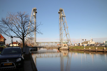 Steel green horizontal lift bridge over Gouwe canal in Waddinxveen Netherlands