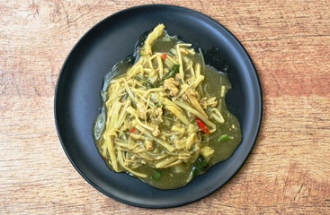 spicy fried sloce bamboo shoot with minced pork in gravy sauce on dish