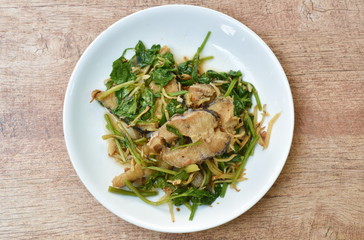 deep fried slice striped snake head fish with ginger and celery on dish