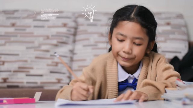 Little Asian girl doing homework with spark idea bulb animation, and chemical formula solution, Thai girl in student kindergarten uniform, learning and education at home