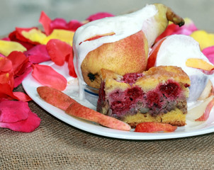 Close up view of fruit cake with pear on the white plate
