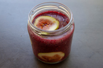 Breakfast acai superfoods smoothies bowl with fresh fig