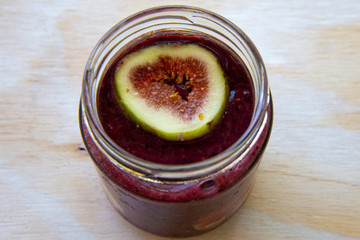 Breakfast acai superfoods smoothies bowl with fresh fig