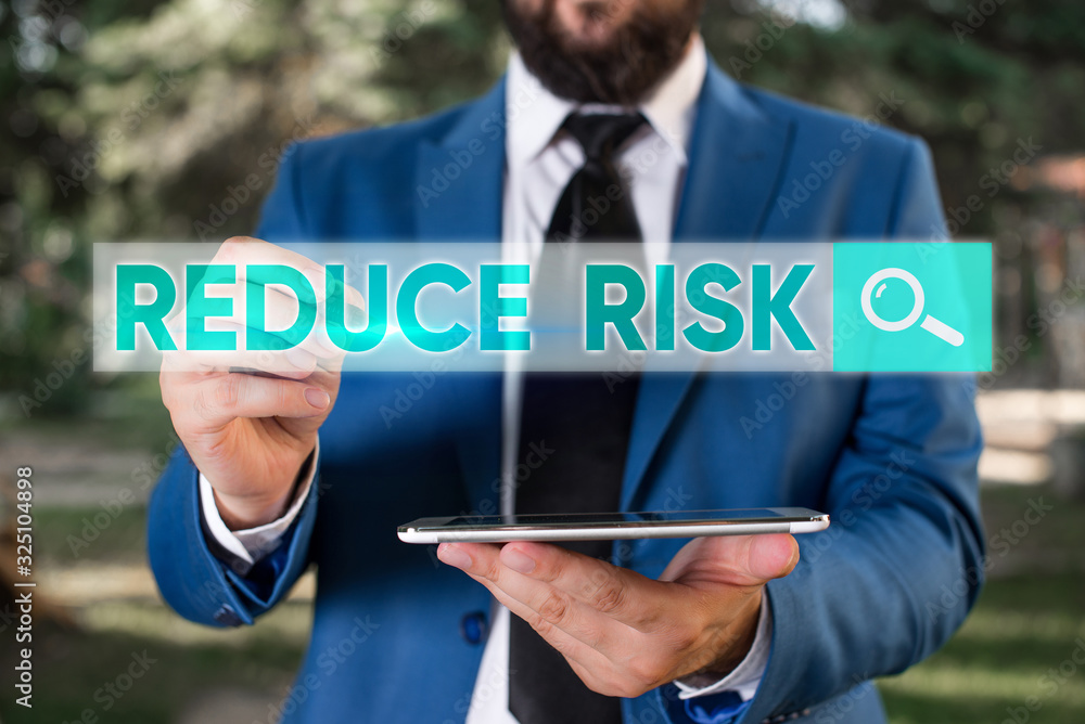 Poster writing note showing reduce risk. business concept for lessen the potential damage that could be cau