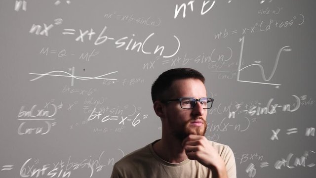 Man with glasses thinks about a mathematical problem and comes up with the solution. Animated formulas, graphs and an enlightening light bulb.