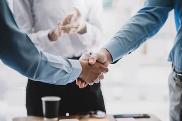 Foto op Canvas Business success. Businessman shaking hands agreement confirmed in the investment business. © amnaj