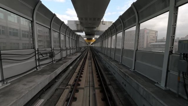 4k, Hyperlapse time-lapse to real speed Effectof of journey on modern driverless. Elevated Rail Metro System, running alongside through tunnel over city.  POV automatic train view through window-Dan