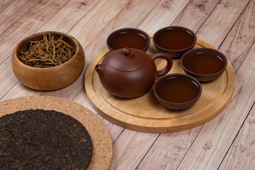 Pressed fermented pu-erh tea with red tea and tea set