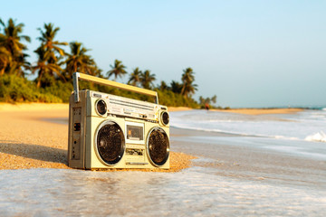 Tape recorder in sea foam and waves. - obrazy, fototapety, plakaty